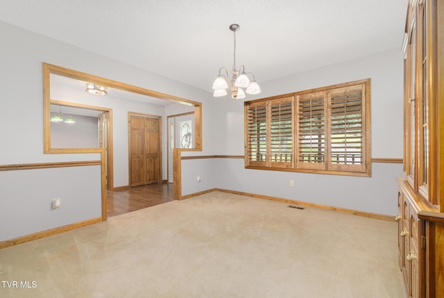 2019 Ridgeview Dr, Big Stone Gap, VA 24219 - carpeted spare room with a chandelier and healthy amount of natural light