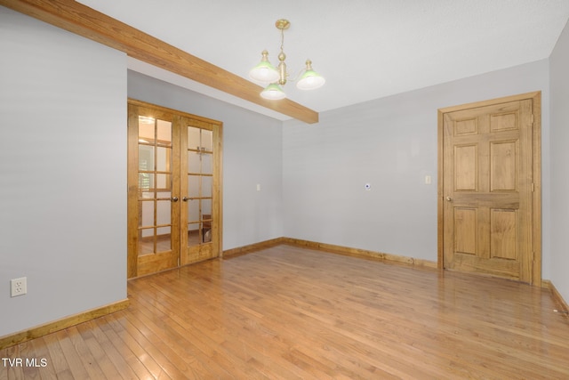 2019 Ridgeview Dr, Big Stone Gap, VA 24219 - empty room featuring french doors, light wood finished floors, and a chandelier