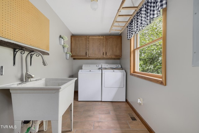 2019 Ridgeview Dr, Big Stone Gap, VA 24219 - laundry room with cabinet space, washer and clothes dryer, and wood finished floors