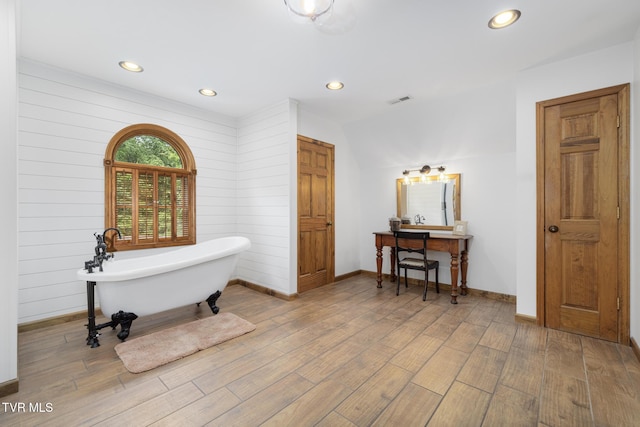 2019 Ridgeview Dr, Big Stone Gap, VA 24219 - full bathroom featuring a freestanding bath, vanity, wood finished floors, and recessed lighting