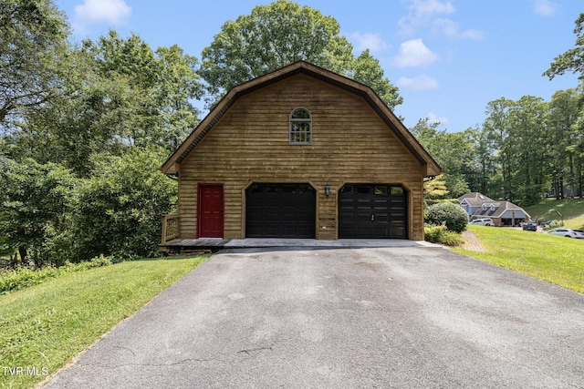 2019 Ridgeview Dr, Big Stone Gap, VA 24219 - view of front of home featuring a gambrel roof, an outbuilding, a front yard, and a garage