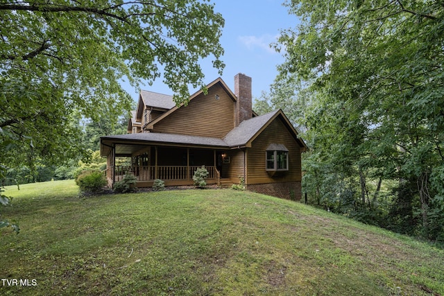 2019 Ridgeview Dr, Big Stone Gap, VA 24219 - rustic home featuring a front lawn and a chimney