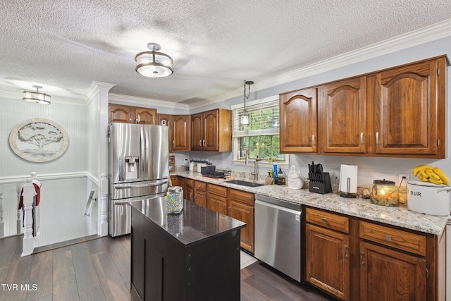 188 Mcarthur Cir, Bristol, VA 24201 - kitchen featuring appliances with stainless steel finishes, brown cabinets, dark wood-type flooring, crown molding, and light stone countertops