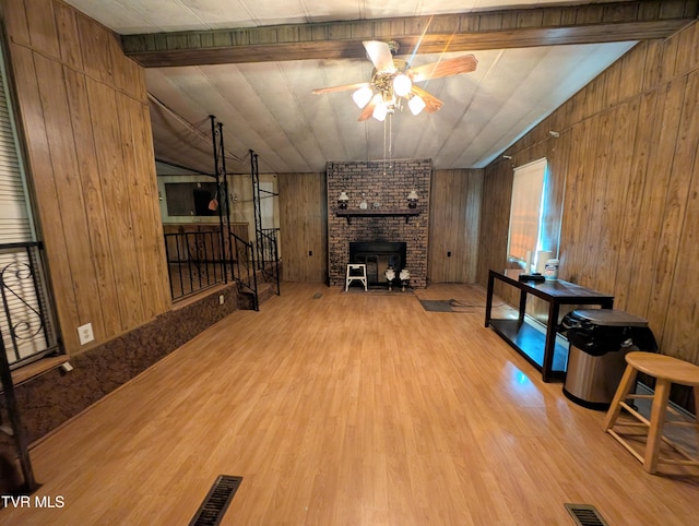 222 Warren Dr, Big Stone Gap, VA 24219 - living area featuring ceiling fan, wood finished floors, a fireplace, wood walls, and stairway