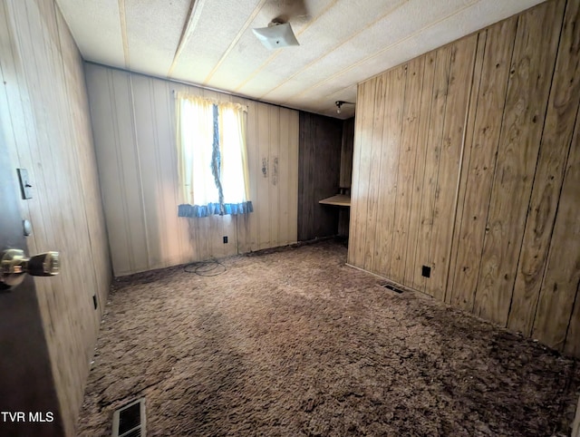 222 Warren Dr, Big Stone Gap, VA 24219 - carpeted spare room featuring wood walls