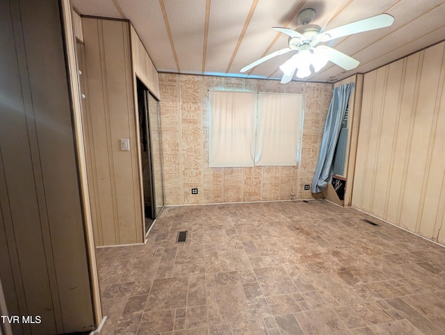 222 Warren Dr, Big Stone Gap, VA 24219 - spare room featuring ceiling fan and stone finish flooring