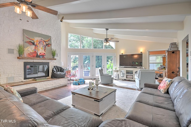 1108 Glen St, Bristol, TN 37620 - living room featuring ceiling fan, wood finished floors, a fireplace, and french doors