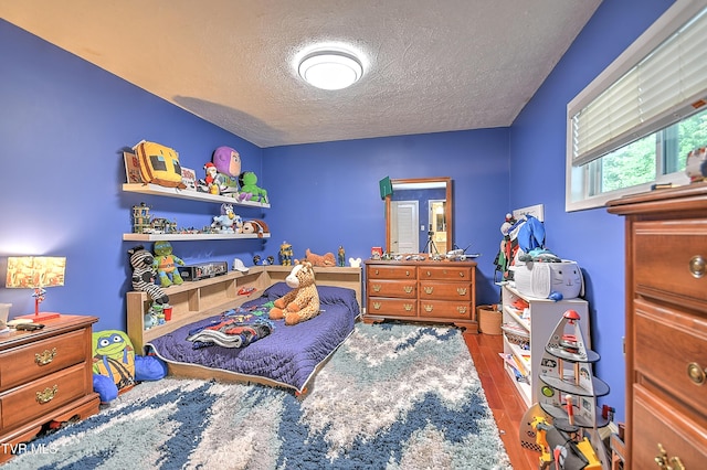 1108 Glen St, Bristol, TN 37620 - bedroom featuring a textured ceiling and wood finished floors