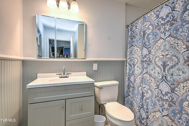 1108 Glen St, Bristol, TN 37620 - full bathroom with wainscoting, vanity, and a shower with curtain