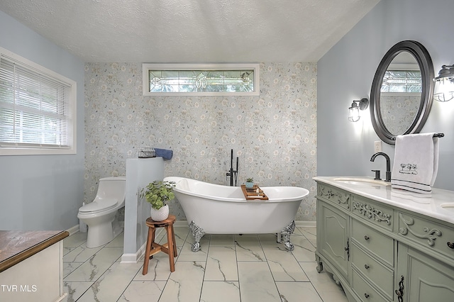 1108 Glen St, Bristol, TN 37620 - full bath featuring a freestanding tub, vanity, marble finish flooring, and a textured ceiling