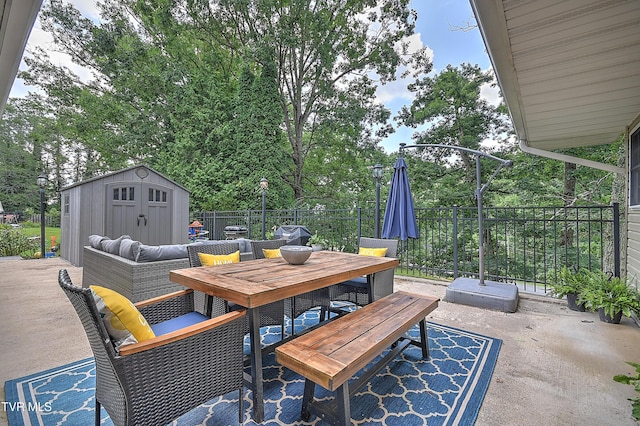 1108 Glen St, Bristol, TN 37620 - view of patio featuring outdoor dining space and a storage unit