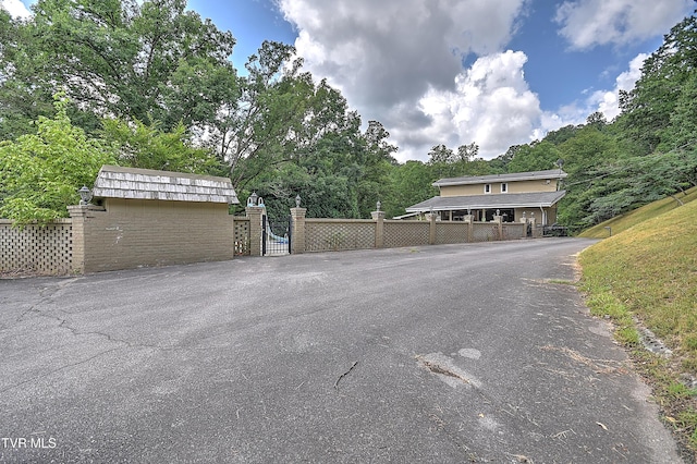 1108 Glen St, Bristol, TN 37620 - view of asphalt driveway featuring a gate