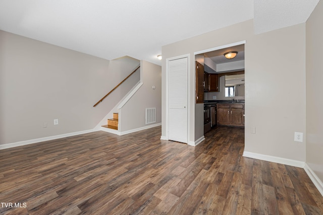 182 Sierra Pl Unit 182, Bristol, VA 24201 - unfurnished living room with dark wood finished floors and stairway