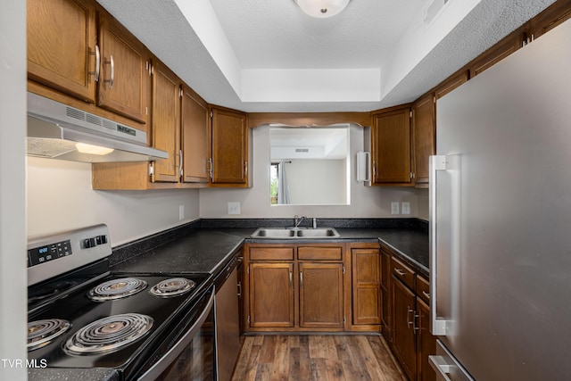 182 Sierra Pl Unit 182, Bristol, VA 24201 - kitchen with stainless steel appliances, under cabinet range hood, dark wood-style flooring, and dark countertops