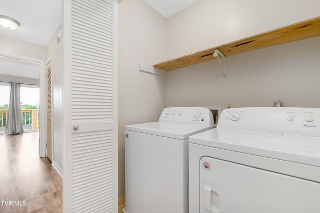 182 Sierra Pl Unit 182, Bristol, VA 24201 - laundry room with washer and clothes dryer and light wood-style flooring