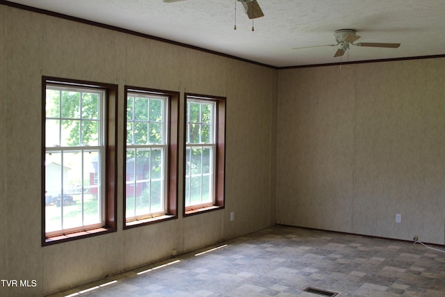 402 Beeline Rd, Duffield, VA 24244 - empty room featuring ceiling fan, a textured ceiling, and ornamental molding