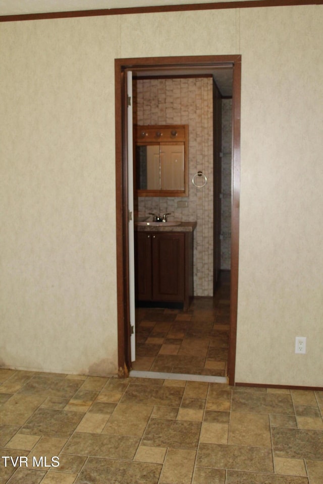 402 Beeline Rd, Duffield, VA 24244 - hallway featuring crown molding and stone finish floors