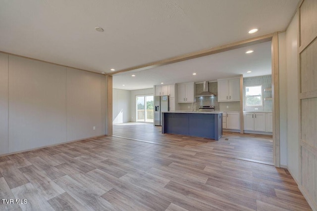 106 Iris Ln, Fall Branch, TN 37656 - unfurnished living room with recessed lighting and light wood-type flooring