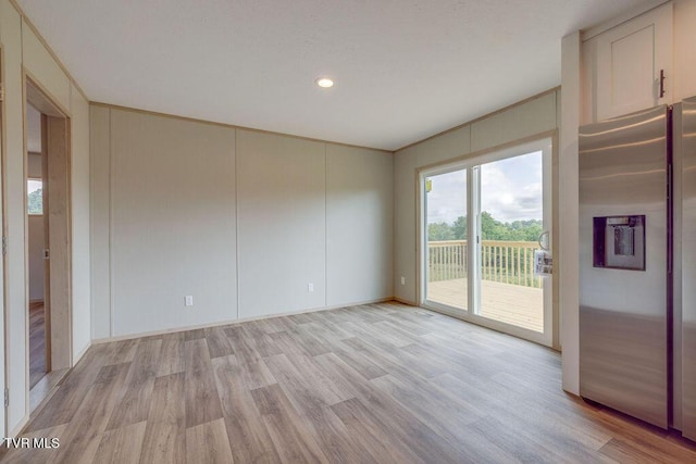 106 Iris Ln, Fall Branch, TN 37656 - spare room featuring light wood finished floors, recessed lighting, and a decorative wall