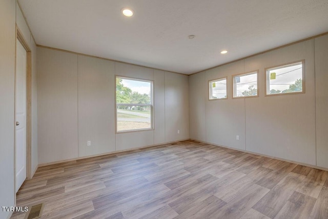 106 Iris Ln, Fall Branch, TN 37656 - unfurnished room featuring healthy amount of natural light, light wood-style flooring, recessed lighting, and a decorative wall