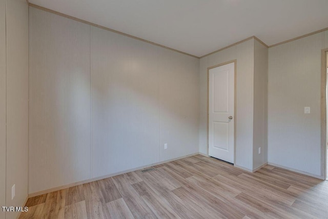 106 Iris Ln, Fall Branch, TN 37656 - spare room featuring crown molding and light wood-style floors
