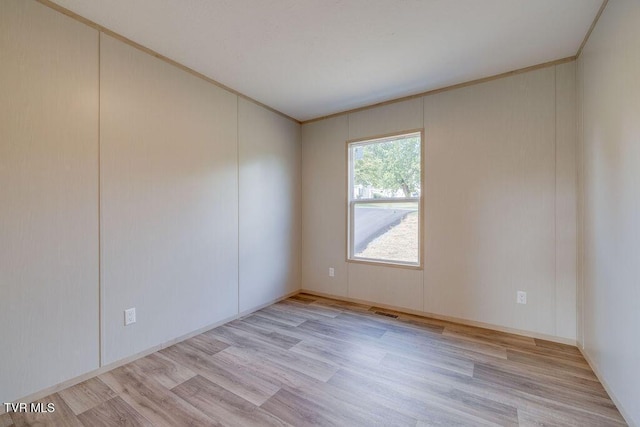 106 Iris Ln, Fall Branch, TN 37656 - empty room featuring light wood-style flooring and crown molding