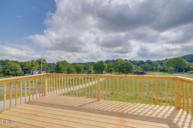 106 Iris Ln, Fall Branch, TN 37656 - wooden deck with a lawn and view of scattered trees