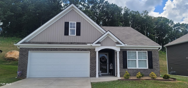 3323 Joshua Ln, Kingsport, TN 37664 - view of front facade with brick siding, concrete driveway, and board and batten siding