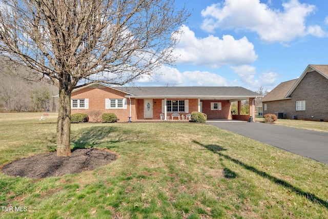 520 Lyle Rd, Erwin, TN 37650 - single story home with a carport, brick siding, a front yard, a porch, and driveway