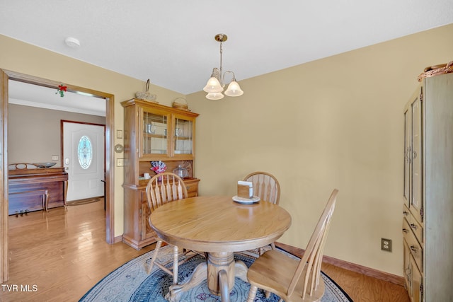 520 Lyle Rd, Erwin, TN 37650 - dining space featuring a chandelier, light wood finished floors, and ornamental molding