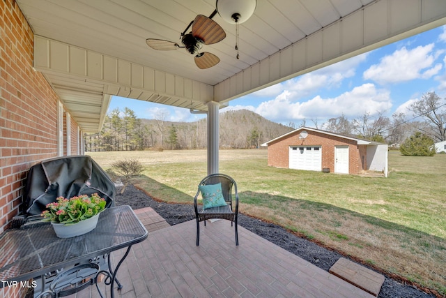 520 Lyle Rd, Erwin, TN 37650 - view of patio featuring a mountain view, an outdoor structure, ceiling fan, and area for grilling
