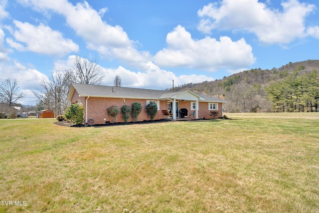 520 Lyle Rd, Erwin, TN 37650 - single story home featuring brick siding, a front lawn, and a mountain view