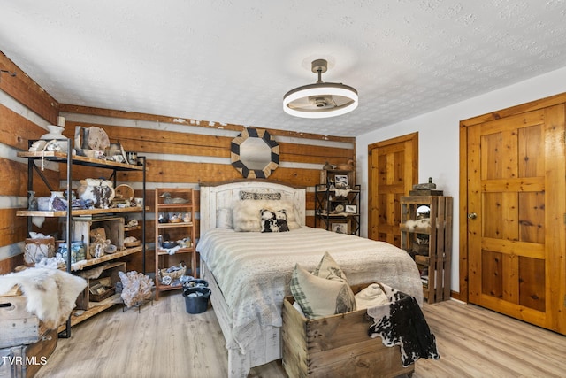 2169 Ranch Rd, Dandridge, TN 37725 - bedroom featuring a textured ceiling and wood finished floors
