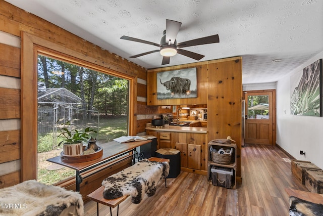 2169 Ranch Rd, Dandridge, TN 37725 - dining space with wood finished floors, ceiling fan, and a textured ceiling