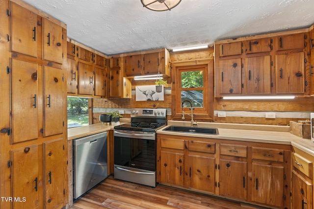 2169 Ranch Rd, Dandridge, TN 37725 - kitchen with stainless steel appliances, plenty of natural light, light countertops, and a textured ceiling