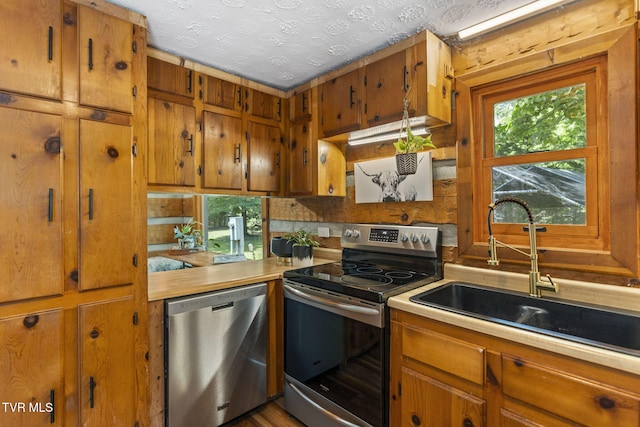 2169 Ranch Rd, Dandridge, TN 37725 - kitchen featuring stainless steel appliances, brown cabinets, and light countertops