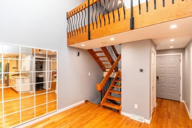 10 Grove Sq Unit 10, Randolph, MA 02368 - stairway with wood finished floors, baseboards, and recessed lighting