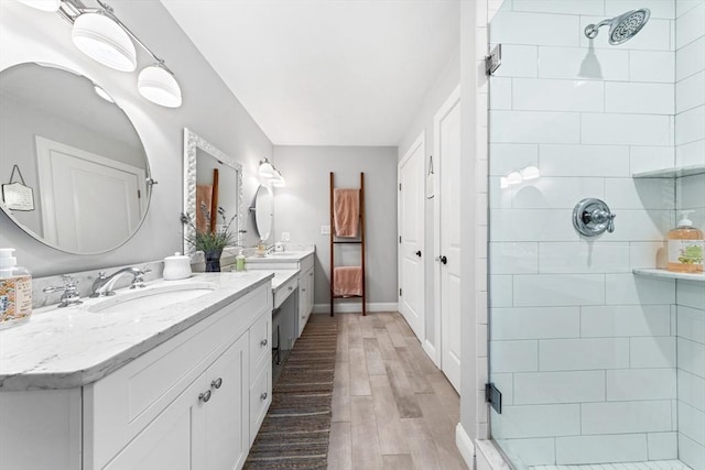 16 Lochmont St, North Attleboro, MA 02760 - full bathroom with a stall shower, wood finished floors, and two vanities