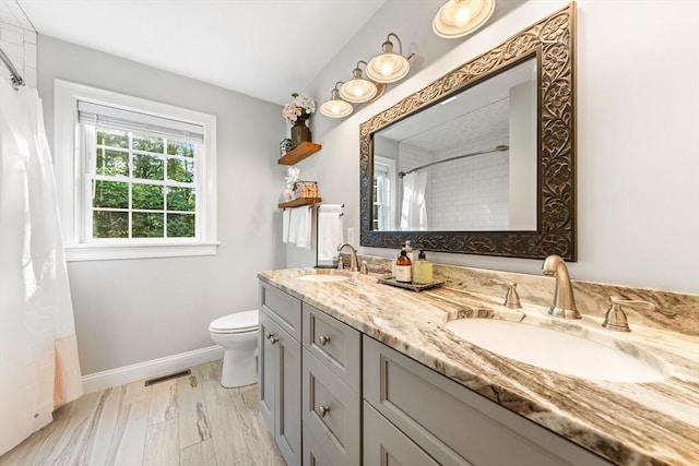 16 Lochmont St, North Attleboro, MA 02760 - bathroom with double vanity and a shower with curtain
