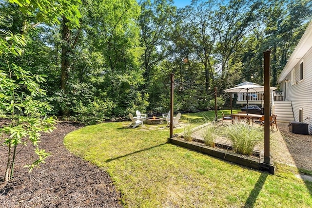 16 Lochmont St, North Attleboro, MA 02760 - view of grassy yard featuring an outdoor fire pit and a wooden deck