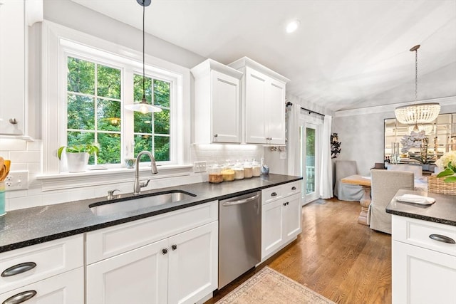 16 Lochmont St, North Attleboro, MA 02760 - kitchen featuring stainless steel dishwasher, wood finished floors, a chandelier, white cabinetry, and lofted ceiling