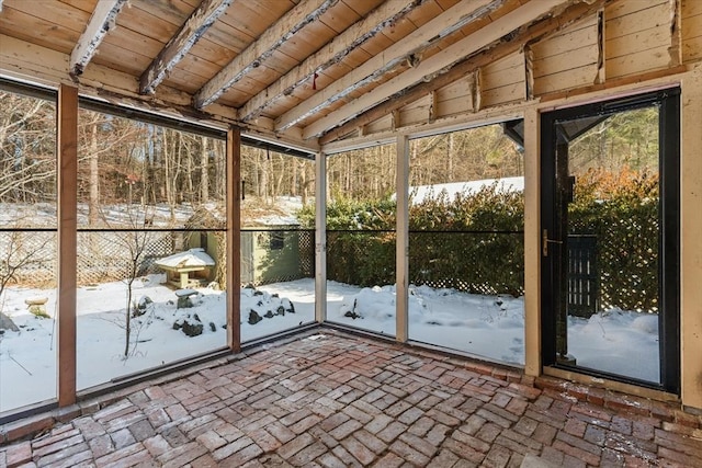 unfurnished sunroom with vaulted ceiling and wood ceiling