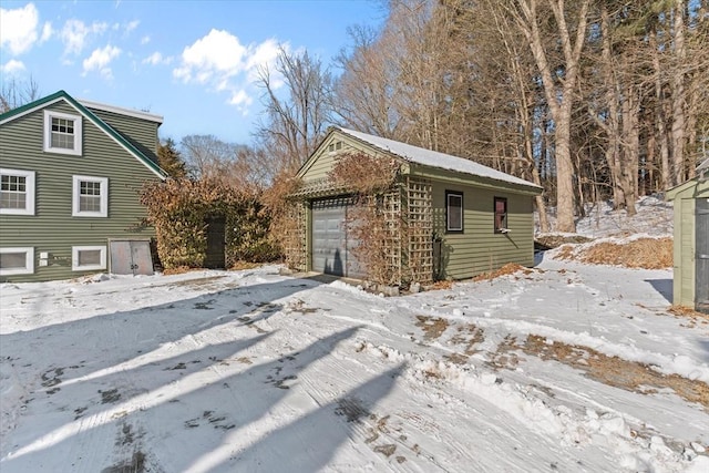 exterior space featuring an outbuilding and a garage