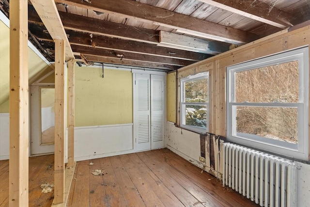 interior space featuring hardwood / wood-style floors and radiator heating unit