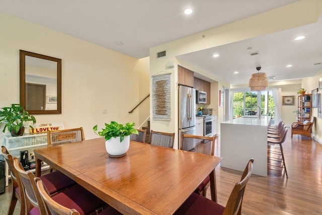 dining room with light wood-type flooring