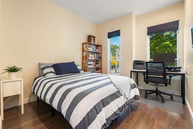 bedroom featuring dark wood-type flooring