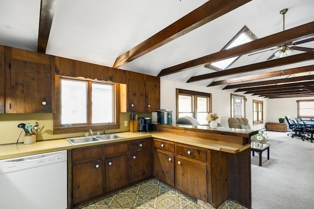 62 Monomoy Cir, Barnstable, MA 02632 - kitchen featuring white dishwasher, a sink, light countertops, and a peninsula