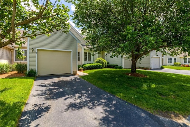 9 Edward Dr Unit 9, Grafton, MA 01536 - obstructed view of property with driveway, a front lawn, and a garage