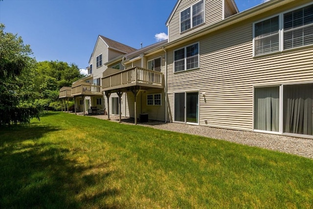 9 Edward Dr Unit 9, Grafton, MA 01536 - rear view of house featuring a yard, a deck, and central AC
