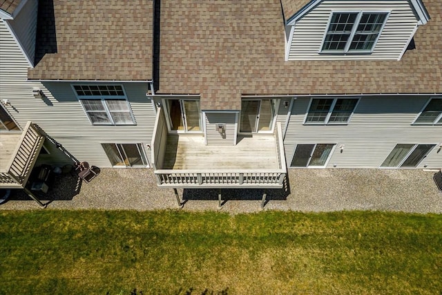 9 Edward Dr Unit 9, Grafton, MA 01536 - back of property featuring roof with shingles, a deck, and a lawn